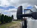 A 2018 Ford F-750 truck with a large side mirror on the driver's side is prominently displayed in the foreground