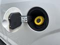 A close-up of the fuel cap of a 2017 Ford F-150 showing the fuel filler neck and warning label on the inside of the cap