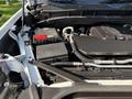 Close-up of the engine compartment of a 2022 GMC Sierra 1500 showing the battery and associated components
