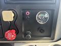 The dashboard control panel of a 2008 International 4400 featuring various gauges buttons and ports for air supply and electrical connections