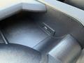 A close-up of the console area in a 2016 Mercedes-Benz Sprinter showing a USB port and textured plastic surfaces