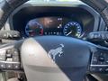 A 2023 Ford Bronco Sport steering wheel featuring a horse logo and various control buttons such as cruise control and audio settings