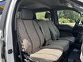 Interior of a 2017 Ford F-550 featuring three textured seats with seat belts and a spacious front cabin layout