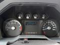 The image shows the dashboard of a 2015 Ford F-350 featuring speedometer tachometer fuel gauge and odometer reading 98751.9 km with a temperature display of 50 degrees Celsius
