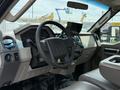 Interior view of a 2008 Ford F-550 featuring a steering wheel dashboard and control panel with various gauges and a mounted screen