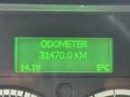Green digital display showing odometer reading of 31470.0 km with additional information of 14.1V and a temperature of 5°C