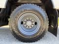 Close-up of a Goodyear Armor Max tire mounted on a wheel of a 2009 International 3000 CE with visible lug nuts and tread pattern