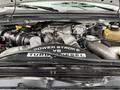 A 2008 Ford F-550 engine with a Power Stroke V8 Turbo Diesel label prominently displayed on the engine cover
