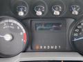 Dashboard of a 2014 Ford F-350 SD showing the instrument panel with gauges for RPM speed fuel and a digital display for trip meter and odometer