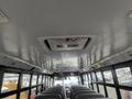 Interior of a 2007 Freightliner B2 school bus featuring rows of seats and overhead emergency exit signage