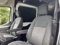 Interior of a 2020 Ford Transit 250 featuring two gray upholstered front seats with armrests and seat belts