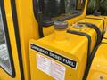 A close-up of a yellow fuel tank labeled CARBURANT DIESEL FUEL with warning and attention signs attached to it