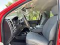 A 2013 RAM 2500 interior showcasing the driver's seat and dashboard with gray upholstery and a center console