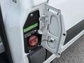 A 2023 Mercedes-Benz Sprinter with its fuel door open revealing a diesel fuel cap and label