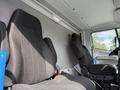 Two fabric-covered seats in a vehicle interior with a simple design and no visible features on the dashboard or control panel