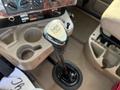 Close-up of an Eaton Fuller gear shift lever inside a 2007 International 9200i truck with buttons and controls visible on the dashboard