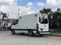 A 2020 Mercedes-Benz Sprinter 2500 with a white exterior and high roof design features a rear door and emergency lights on the roof