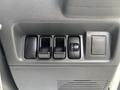 Control panel featuring window switches and a button for power locks in a 2010 Daihatsu Hijet