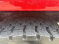 Close-up of a rugged tire from a 2012 International 7300 Workstar showcasing its deep tread pattern designed for off-road and heavy-duty use