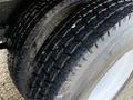 Close-up of a tire from a 2010 International 4300 showing detailed tread pattern and sidewall texture