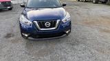 A blue 2019 Nissan Kicks SUV with a distinctive front grille and headlights facing forward