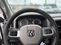 Steering wheel and dashboard of a 2011 Dodge Ram 5500 with instrument gauges and controls visible