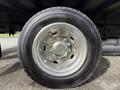Close-up of a shiny silver wheel with a black tire labeled ST 918 from a 2008 International CityStar truck