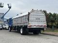 A blue 2017 Autocar Xpert garbage truck with a silver rear compactor container and caution signs indicating frequent stops and wide right turns