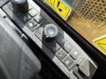 Close-up of control panel with buttons and knobs from a 2022 Caterpillar 306 heavy equipment machine