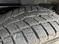 Close-up of a treaded tire from a 2018 Chevrolet Colorado showcasing deep grooves and detailed patterns designed for traction and stability