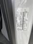 A close-up view of the VIN label on a 2019 Ford Transit displaying vehicle information and identification details