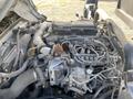 Engine of a 2019 Hino 195 with various components including hoses wires and a metal casing visible in the foreground