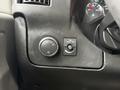 A dashboard panel from a 2019 Chevrolet Express featuring controls for headlights and vehicle settings