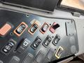 Dashboard controls of a 2007 Freightliner B2 showing various switches and buttons for vehicle functions
