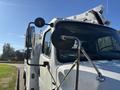 A white 2005 Freightliner M2 106 truck with side mirrors and a utility bucket mounted on the back