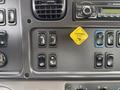 Dashboard controls of a 2016 Freightliner 108SD featuring various switches and a yellow parking brake indicator