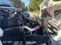 A 2004 Ford F-750 with the hood open revealing the engine compartment and various components such as the air intake and radiator
