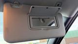 A car's sun visor with a mirror on the inside in a 2019 Nissan Kicks