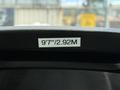 A label indicating a height of 9 feet 7 inches or 2.92 meters is displayed on the interior of a 2016 Ford Transit