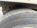 Close-up of a worn tire from a 2010 Great Dane trailer showing significant tread wear and cracks on the sidewall