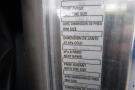 A close-up of a specification label from a 2015 Kenworth T660 displaying tire sizes and pressure information