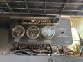 Control panel featuring three gauges labeled receiver pressure, hour meter, and discharge temperature with wires visible below