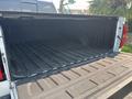 The image shows the open bed of a 2017 Chevrolet Silverado 1500 with a textured black liner and ridged sides