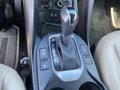 Close up of the gear shift and controls of a 2018 Hyundai Santa Fe with buttons for park reverse neutral and drive