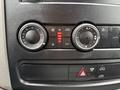 Dashboard controls of a 2017 Mercedes-Benz Sprinter featuring climate settings with dials for temperature and fan speed along with an A/C button