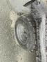 Close-up of a rugged tire from a 2010 Kubota RTV 900 showcasing deep treads and a robust design