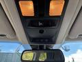 Interior view of a 2014 RAM 5500 ceiling console featuring two light fixtures a mirror and control buttons for the truck's features