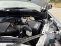 Close-up of the engine compartment of a 2019 Chevrolet Silverado 1500 showing the air intake manifold and various engine components visible