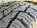 Close-up of a tire tread showcasing deep grooves and patterns on a 2010 Mercedes-Benz Sprinter tire