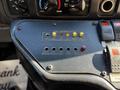The control panel of a 2016 Ford Econoline featuring buttons and lights for various functions including lift interlock and emergency stop